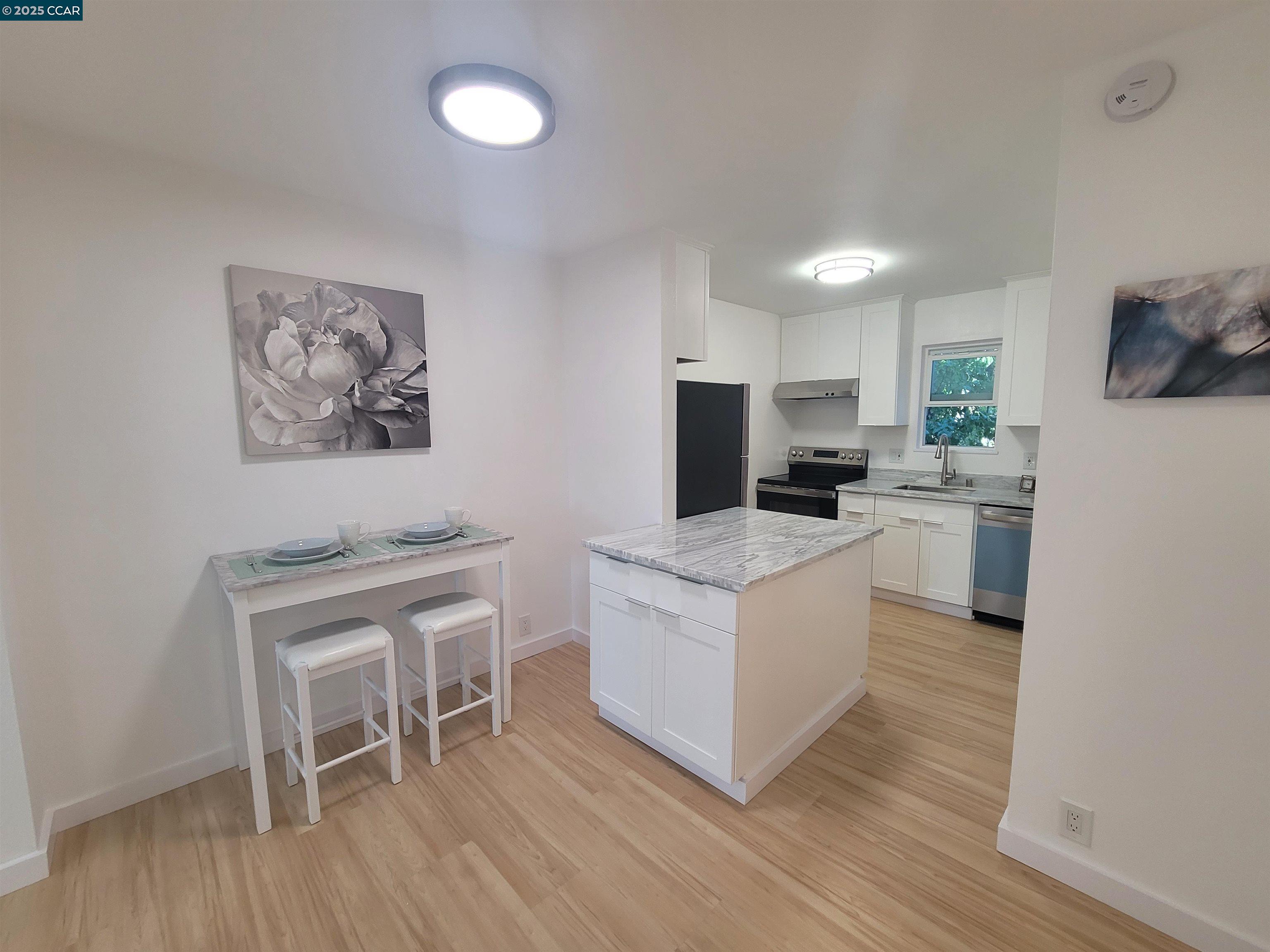 375 Camelback Road, Unit 23 Pleasant Hill, CA 94523 - Photo 46 of 58 a kitchen with a sink cabinets and wooden floor