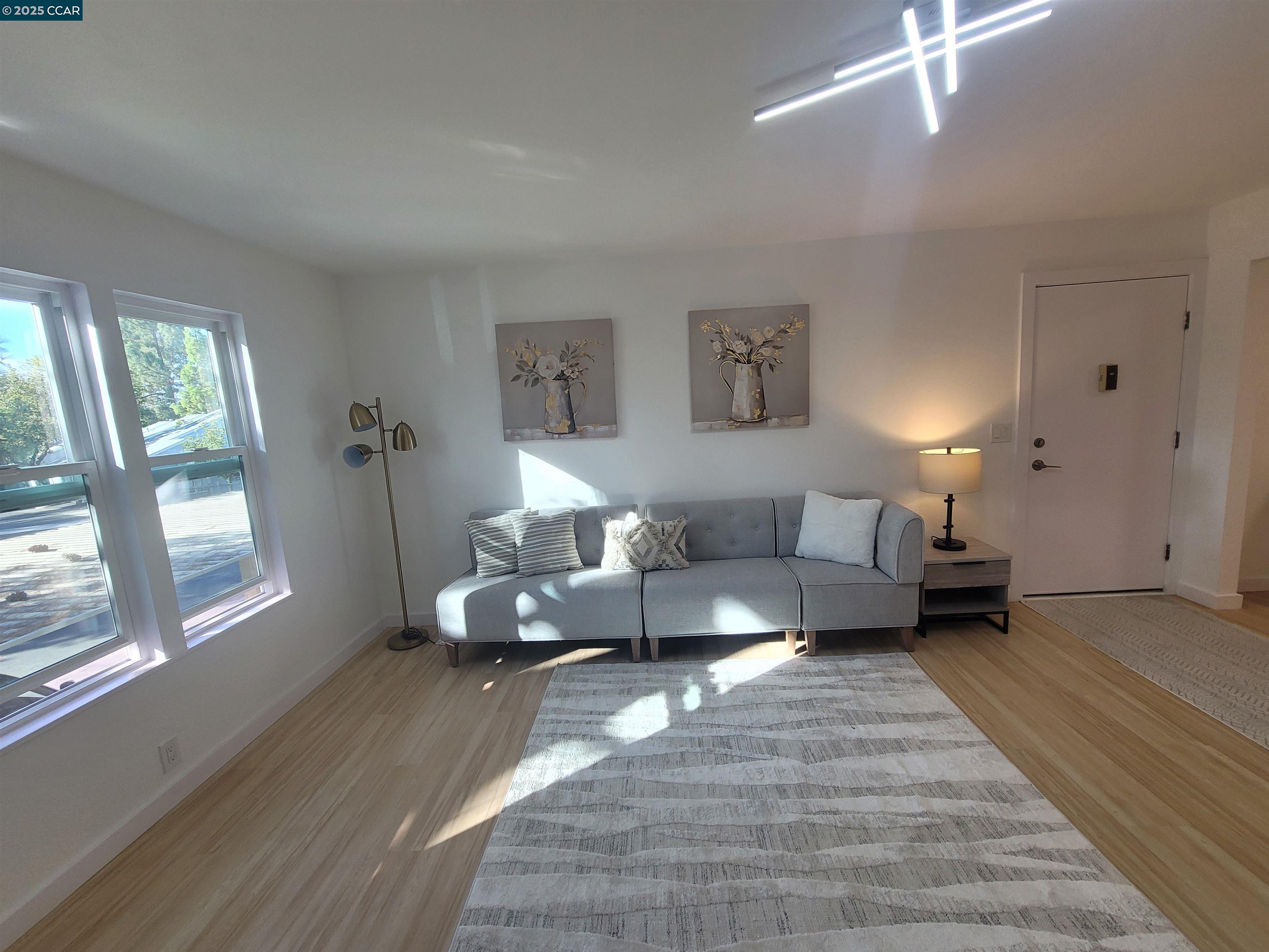 375 Camelback Road, Unit 23 Pleasant Hill, CA 94523 - Photo 5 of 42 a living room with furniture and a large window