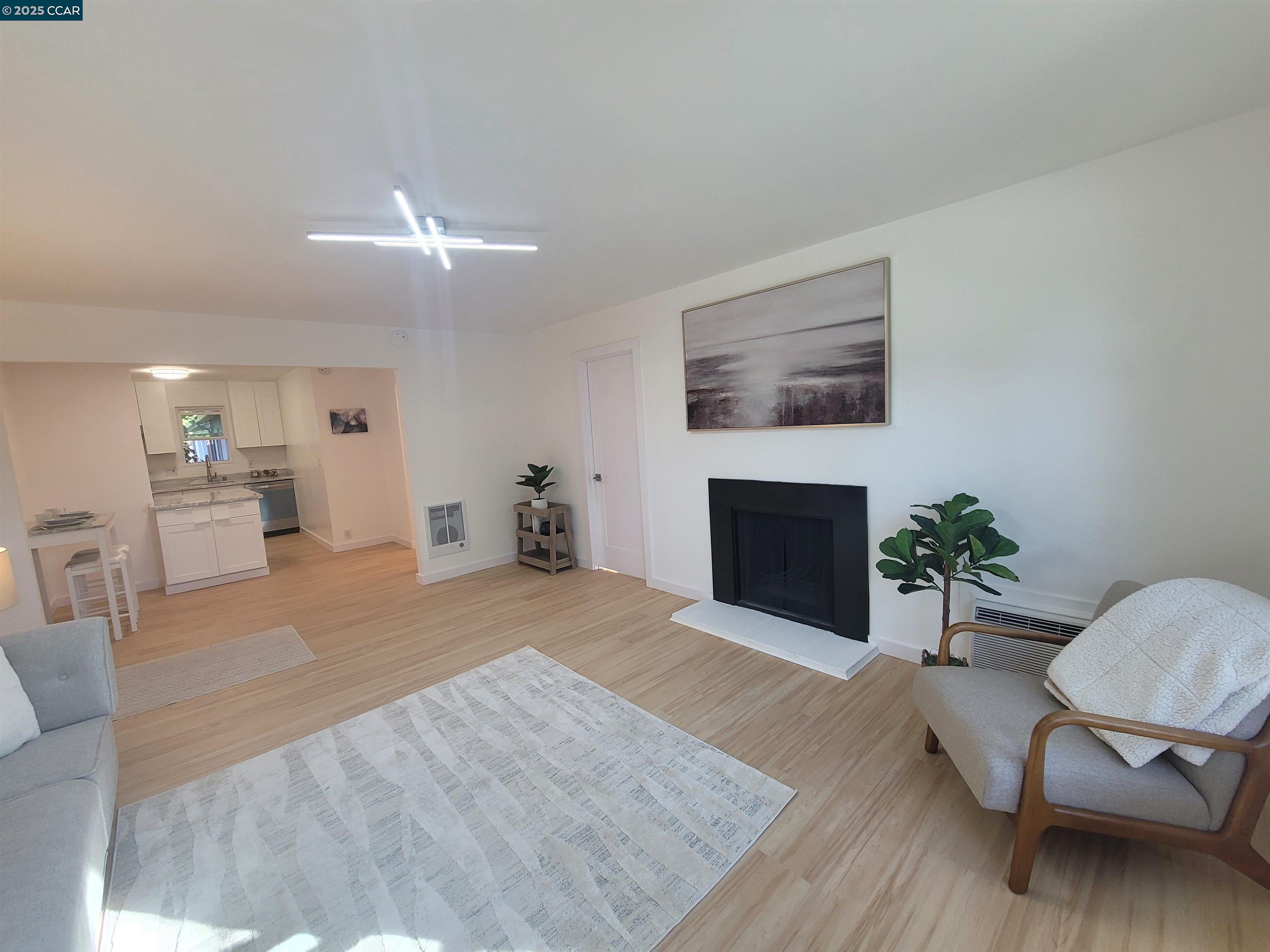 375 Camelback Road, Unit 23 Pleasant Hill, CA 94523 - Photo 7 of 42 a living room with furniture and a fireplace