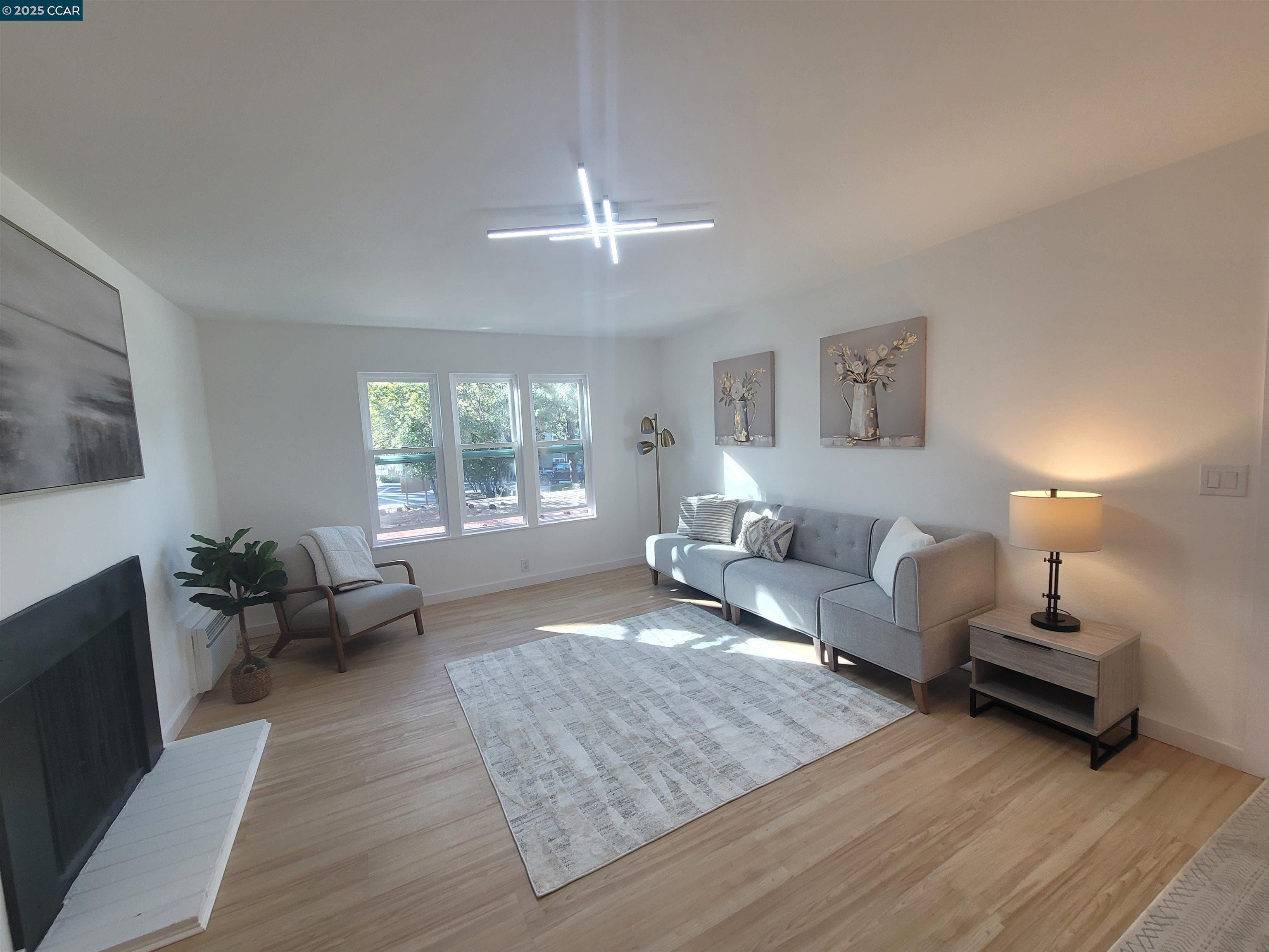 375 Camelback Road, Unit 23 Pleasant Hill, CA 94523 - Photo 10 of 42 a living room with furniture and a large window