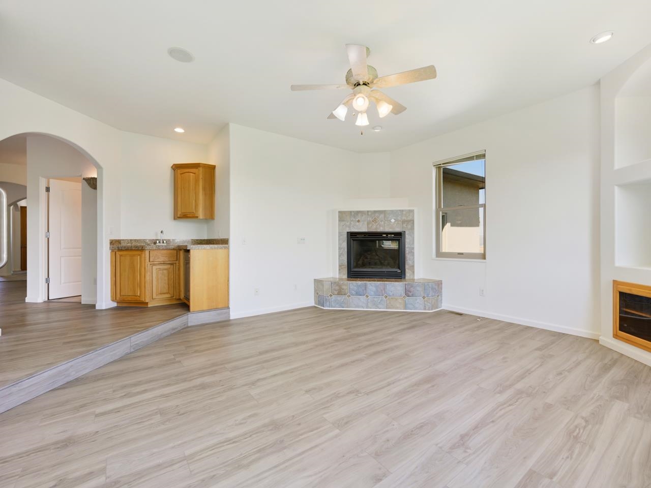2107 I I- 1/2 Road Grand Junction, CO 81505 - Photo 12 of 42 a view of an empty room with a fireplace and a window