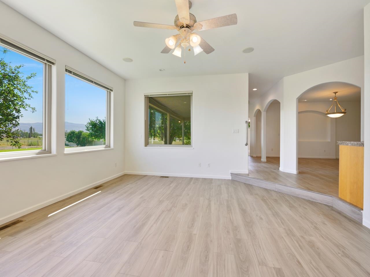 2107 I I- 1/2 Road Grand Junction, CO 81505 - Photo 13 of 42 a view of an empty room with a window and wooden floor