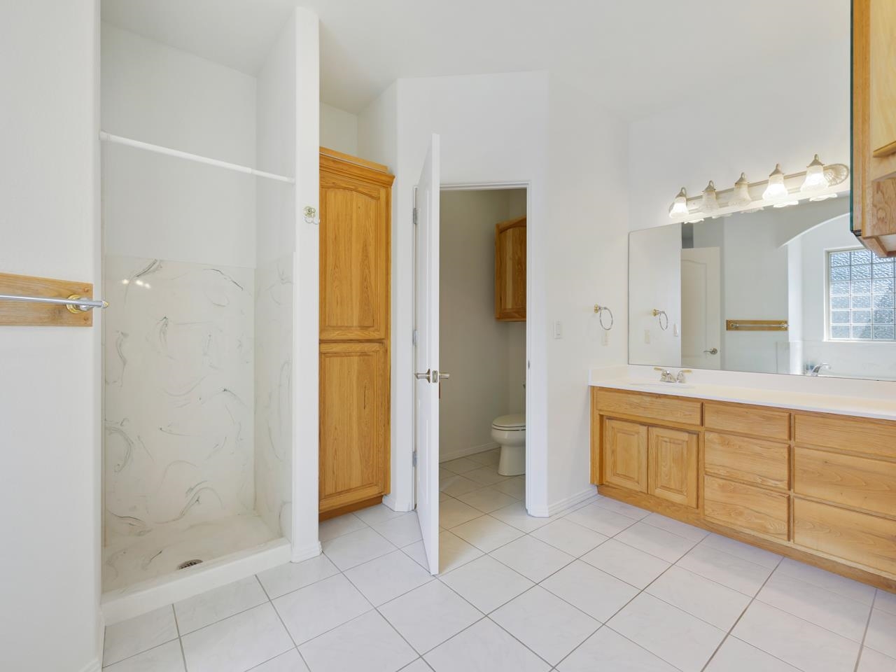 2107 I I- 1/2 Road Grand Junction, CO 81505 - Photo 18 of 42 a spacious bathroom with a mirror sink and shower