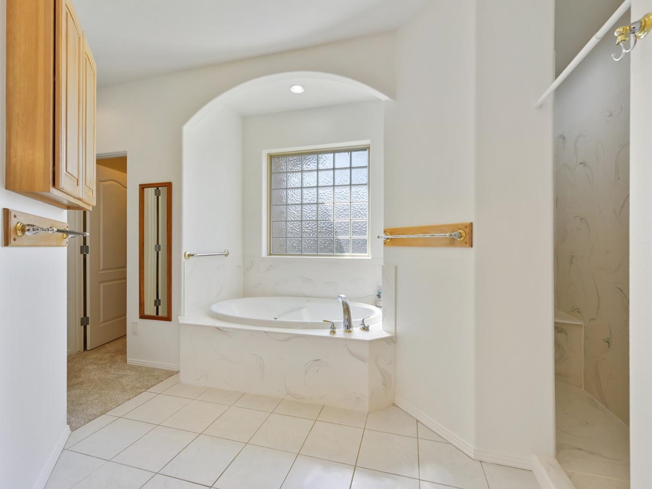 2107 I I- 1/2 Road Grand Junction, CO 81505 - Photo 19 of 42 a bathroom with a bathtub and a sink