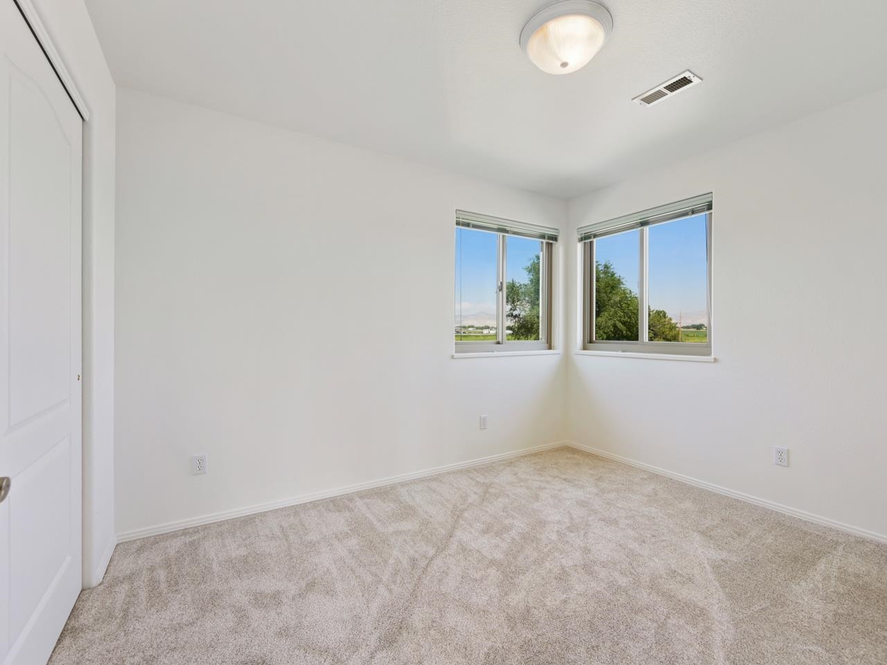 2107 I I- 1/2 Road Grand Junction, CO 81505 - Photo 28 of 42 an empty room with windows and closet
