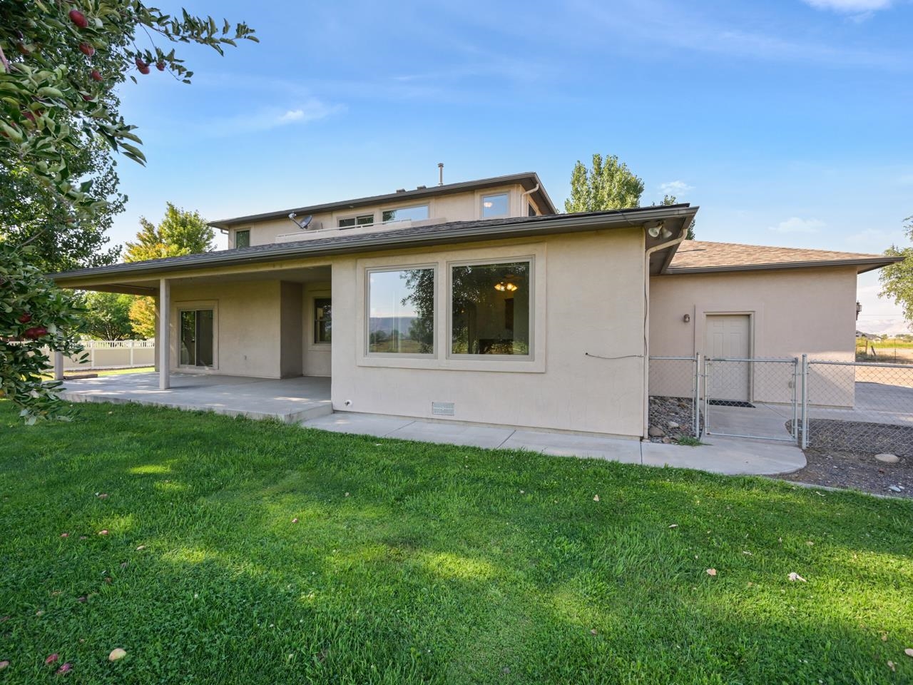 2107 I I- 1/2 Road Grand Junction, CO 81505 - Photo 33 of 42 a front view of a house with a yard and garage