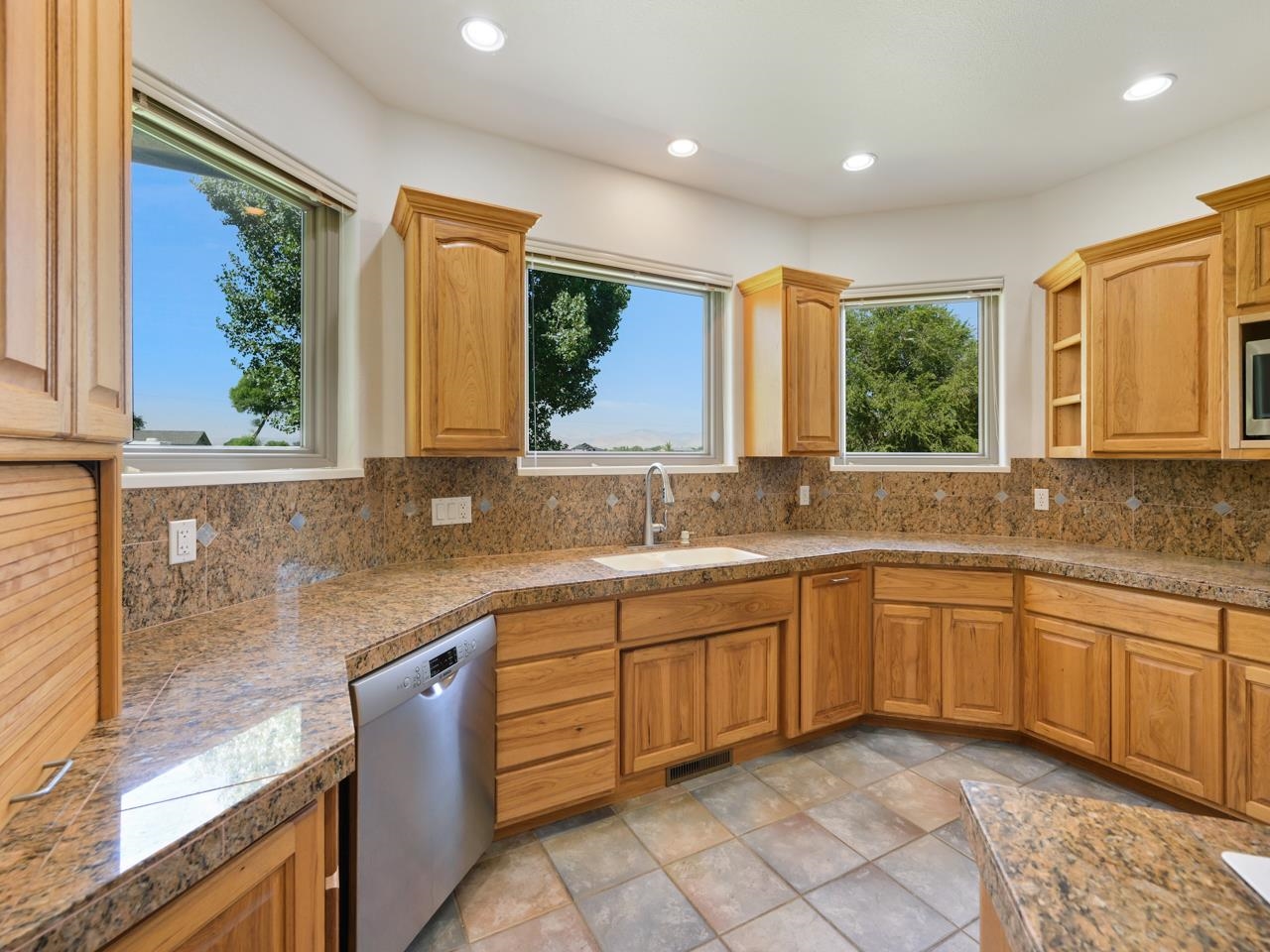 2107 I I- 1/2 Road Grand Junction, CO 81505 - Photo 5 of 42 a kitchen with a sink window and cabinets