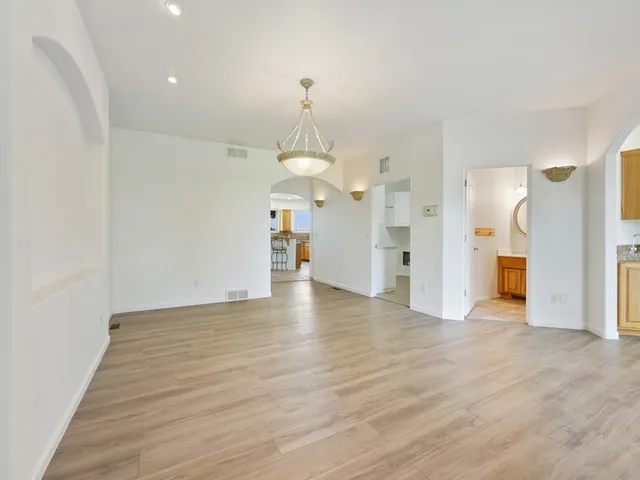 a view of a kitchen with a dishwasher cabinets and wooden floor