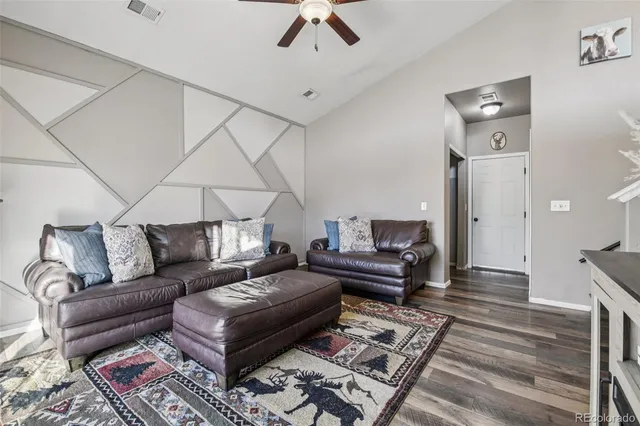 a living room with furniture and a rug
