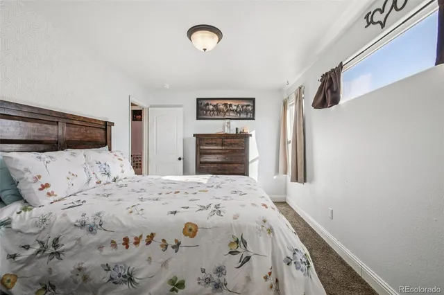 a bedroom with a bed and a cabinets