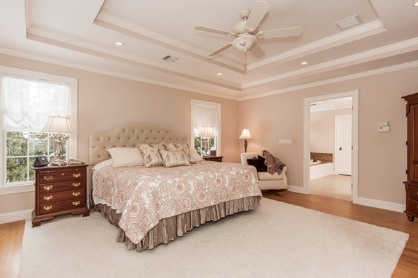3 Bridle Path Road Wilbraham, MA 01095 - Photo 20 of 30 a spacious bedroom with a bed a dresser and a chandelier