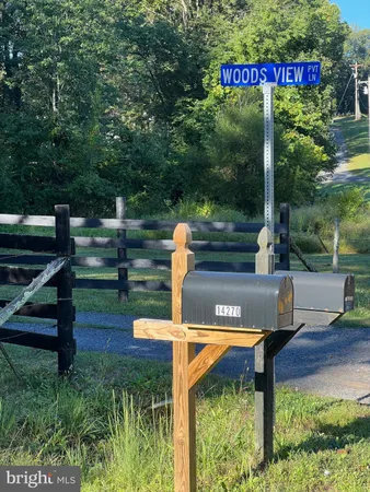 a view of a park that has a sign on the side of it