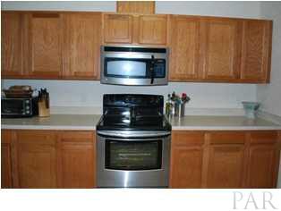 4871 Pineview Ridge Road Pace, FL 32571 - Photo 5 of 16 Beautiful Oak Cabinets and Stainless Appliances
