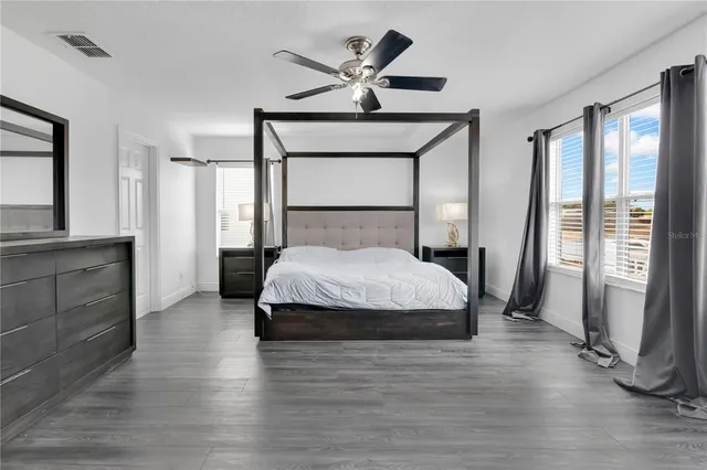 a bedroom with a bed and window