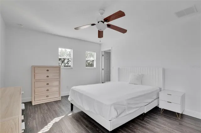 a bedroom with a bed and a dresser