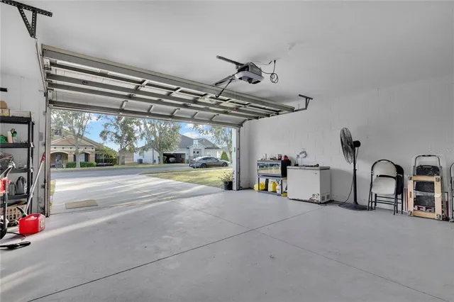 a view of a tables and chairs under an umbrella in a patio