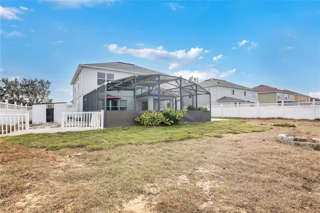 an aerial view of a house with a swimming pool