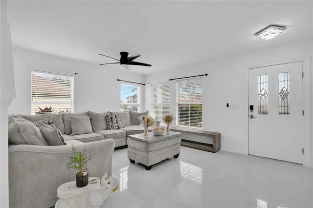 a living room with furniture and a large window