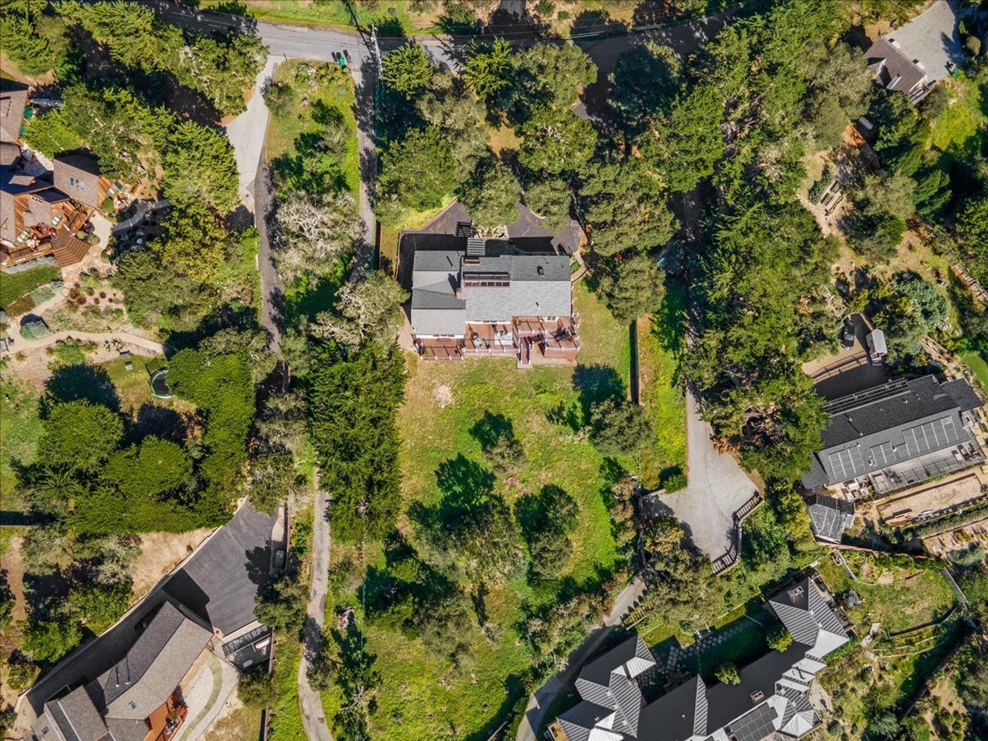 15 Mentone Road Carmel, CA 93923 - Photo 42 of 47 an aerial view of a house with a yard and garden