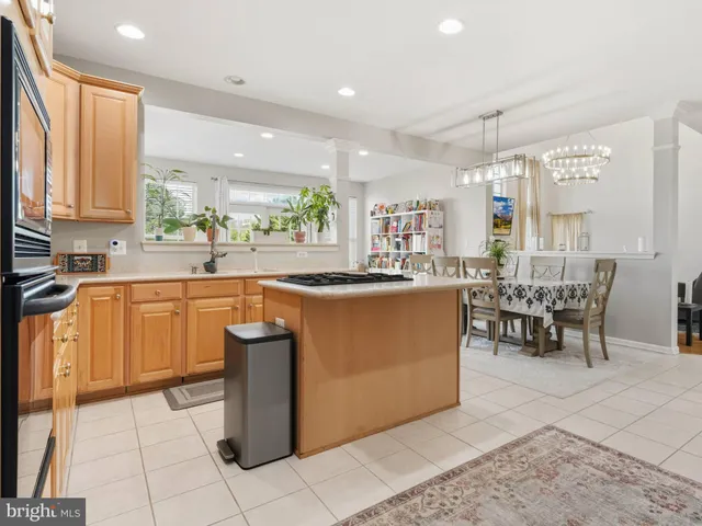 a kitchen with a sink a counter top space and appliances