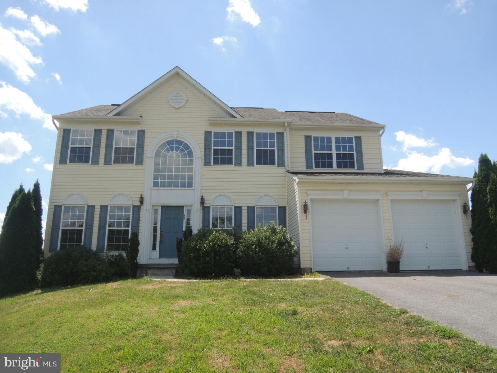45 Boise Road Inwood, WV 25428 - Photo 1 of 30 a front view of a house with a yard and garage