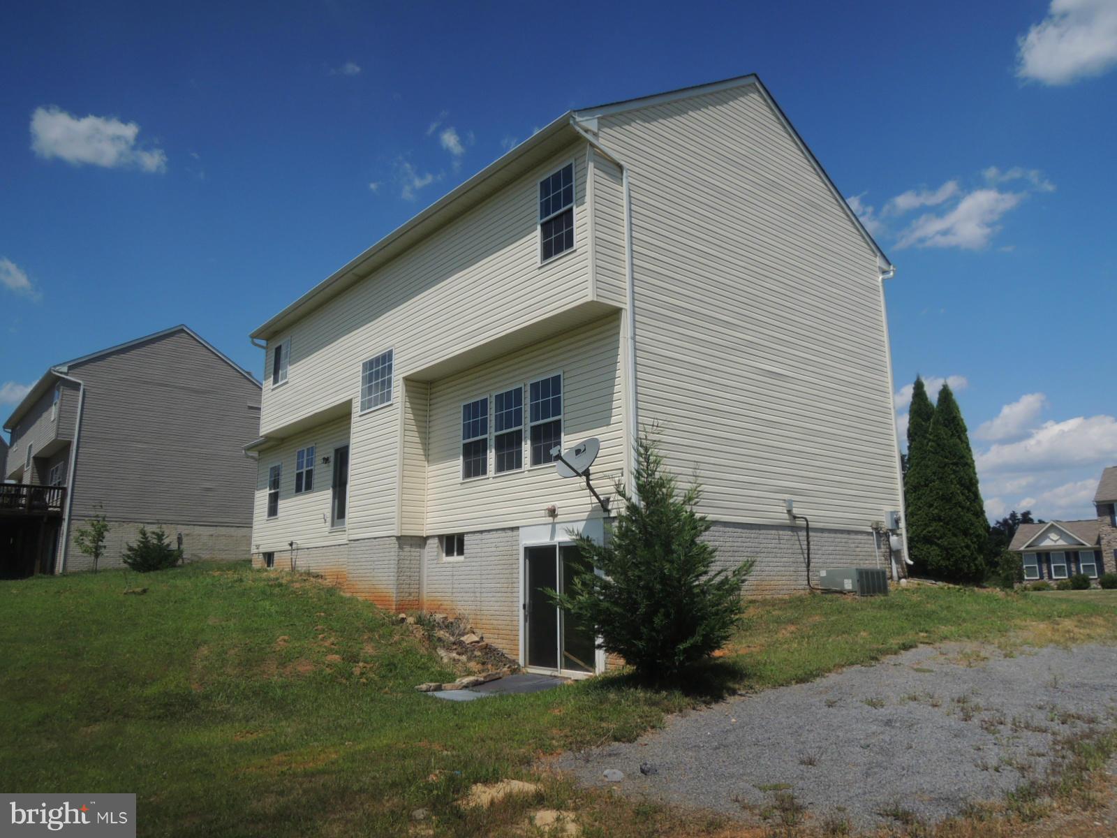 45 Boise Road Inwood, WV 25428 - Photo 2 of 30 a front view of a house with garden