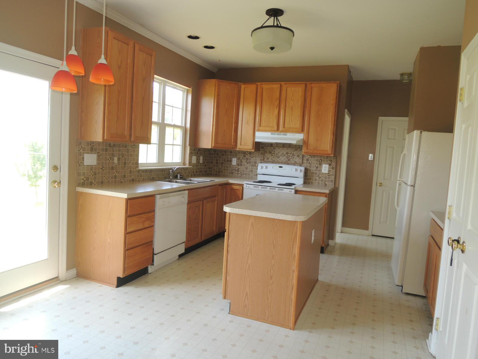 45 Boise Road Inwood, WV 25428 - Photo 12 of 30 a kitchen with a sink stove and refrigerator