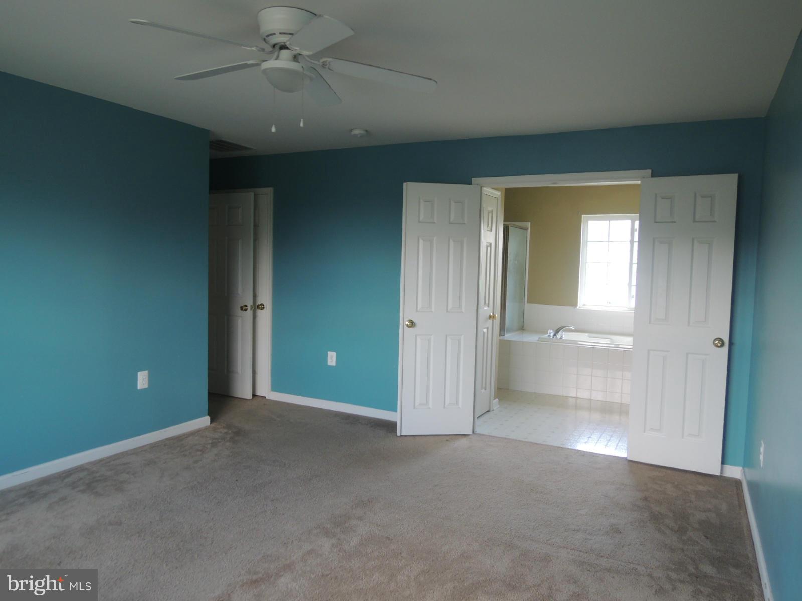 45 Boise Road Inwood, WV 25428 - Photo 14 of 30 an empty room with fan and entrance