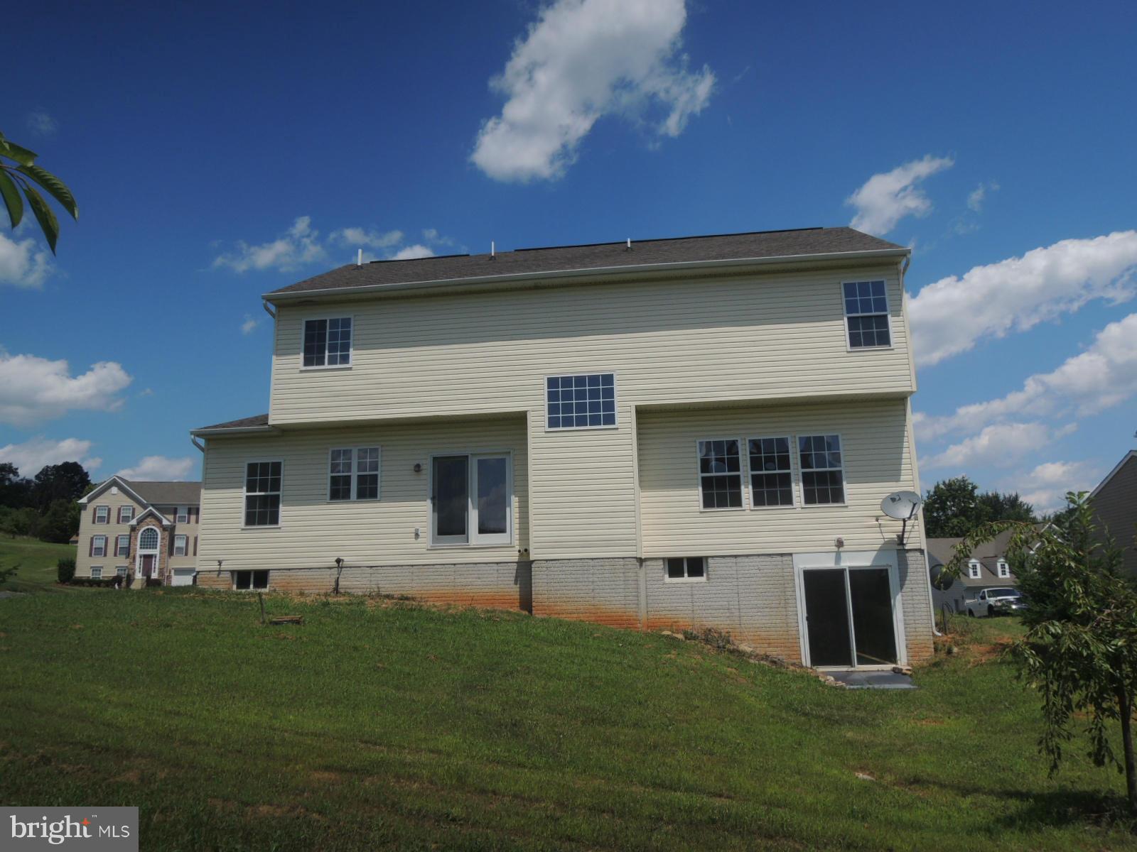 45 Boise Road Inwood, WV 25428 - Photo 3 of 30 a front view of a house with a garden