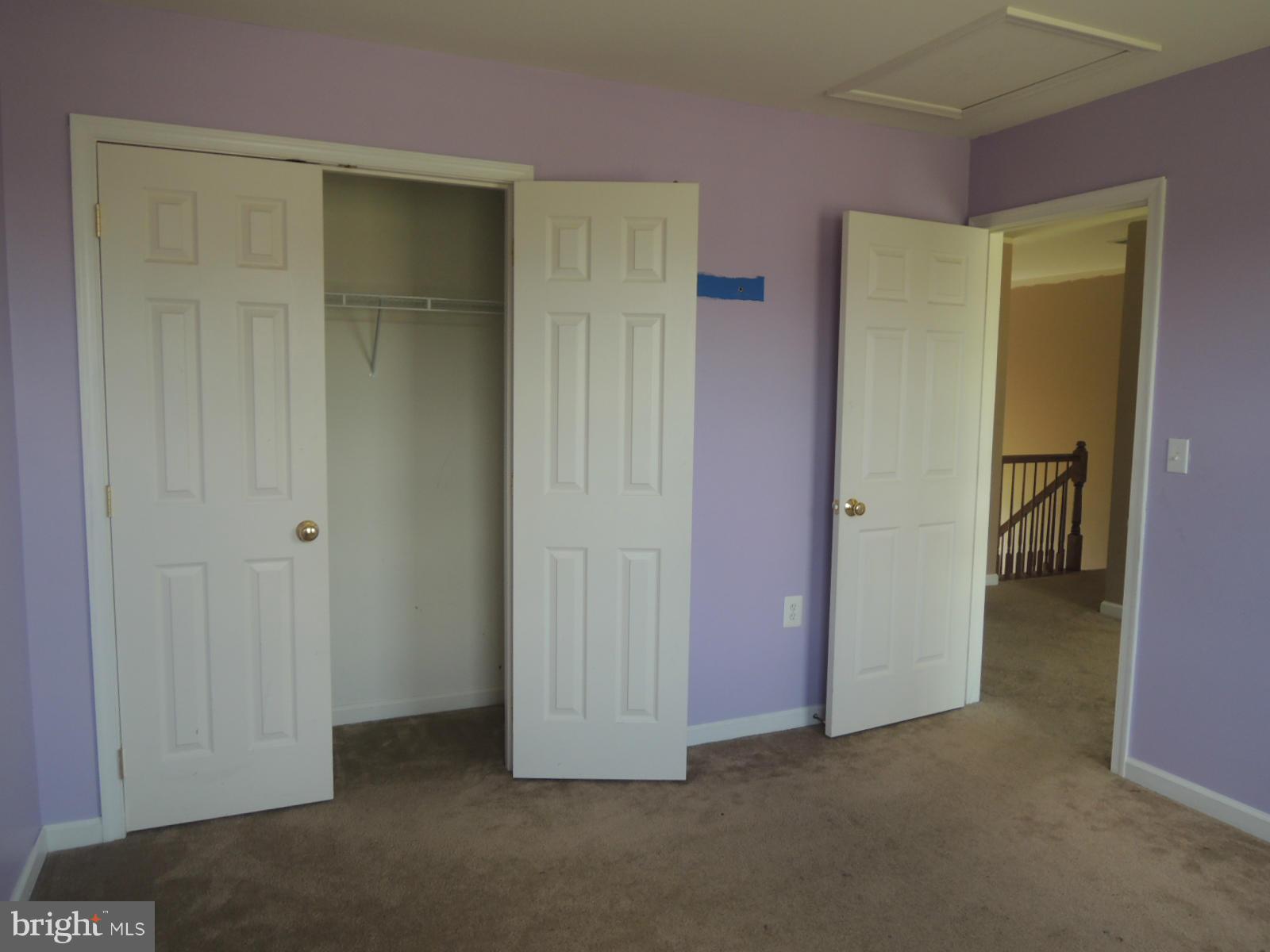 45 Boise Road Inwood, WV 25428 - Photo 21 of 30 an empty room with closet and mirror