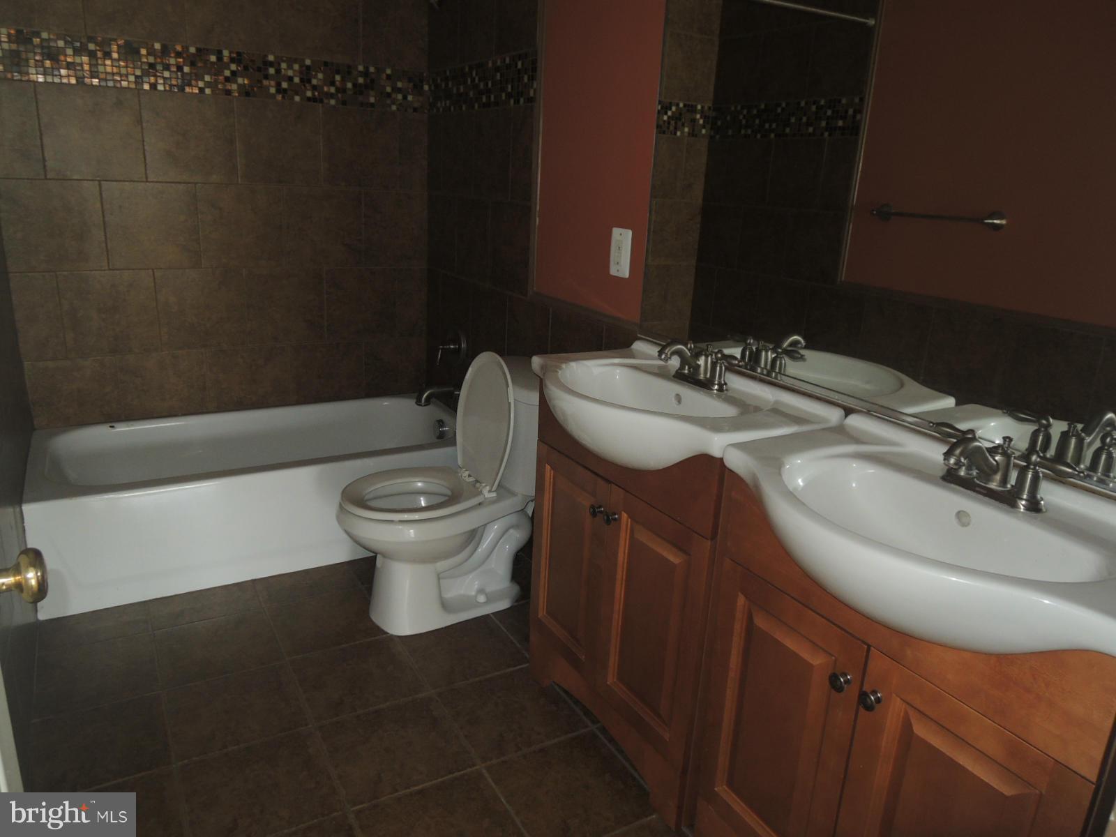 45 Boise Road Inwood, WV 25428 - Photo 22 of 30 a bathroom with a sink toilet mirror and vanity