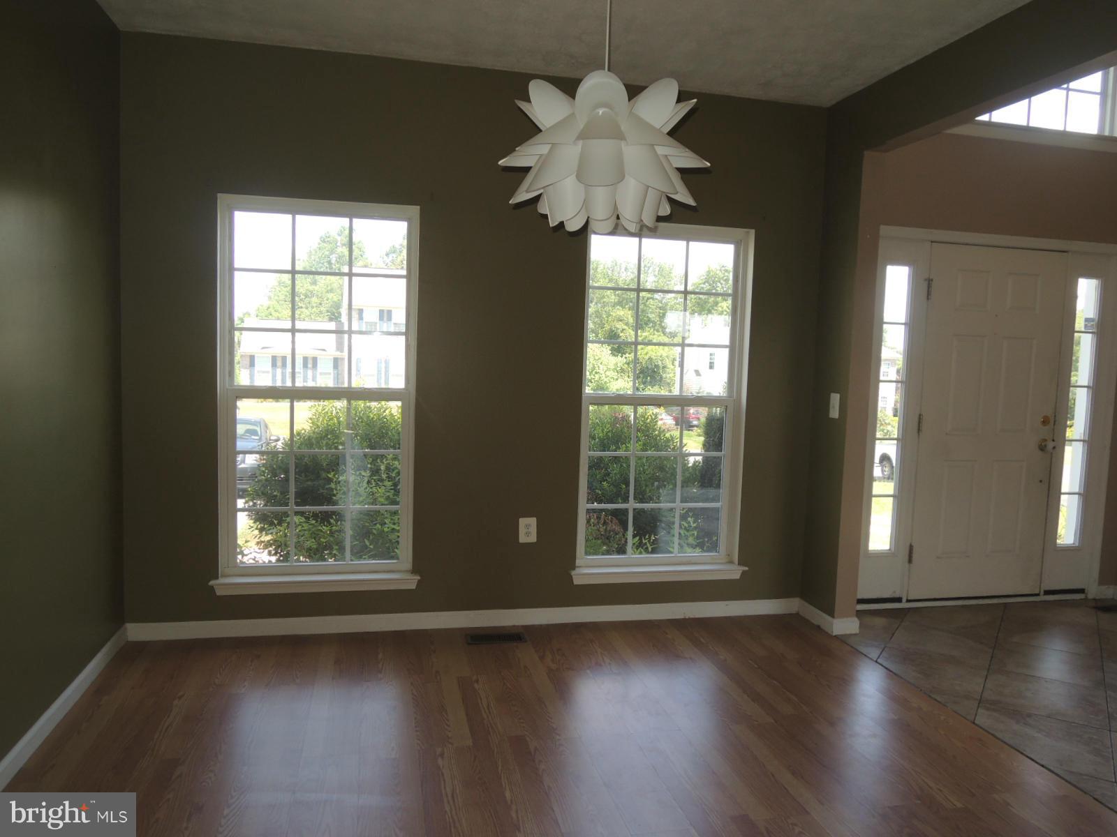 45 Boise Road Inwood, WV 25428 - Photo 7 of 30 a view of an empty room with wooden floor and a window