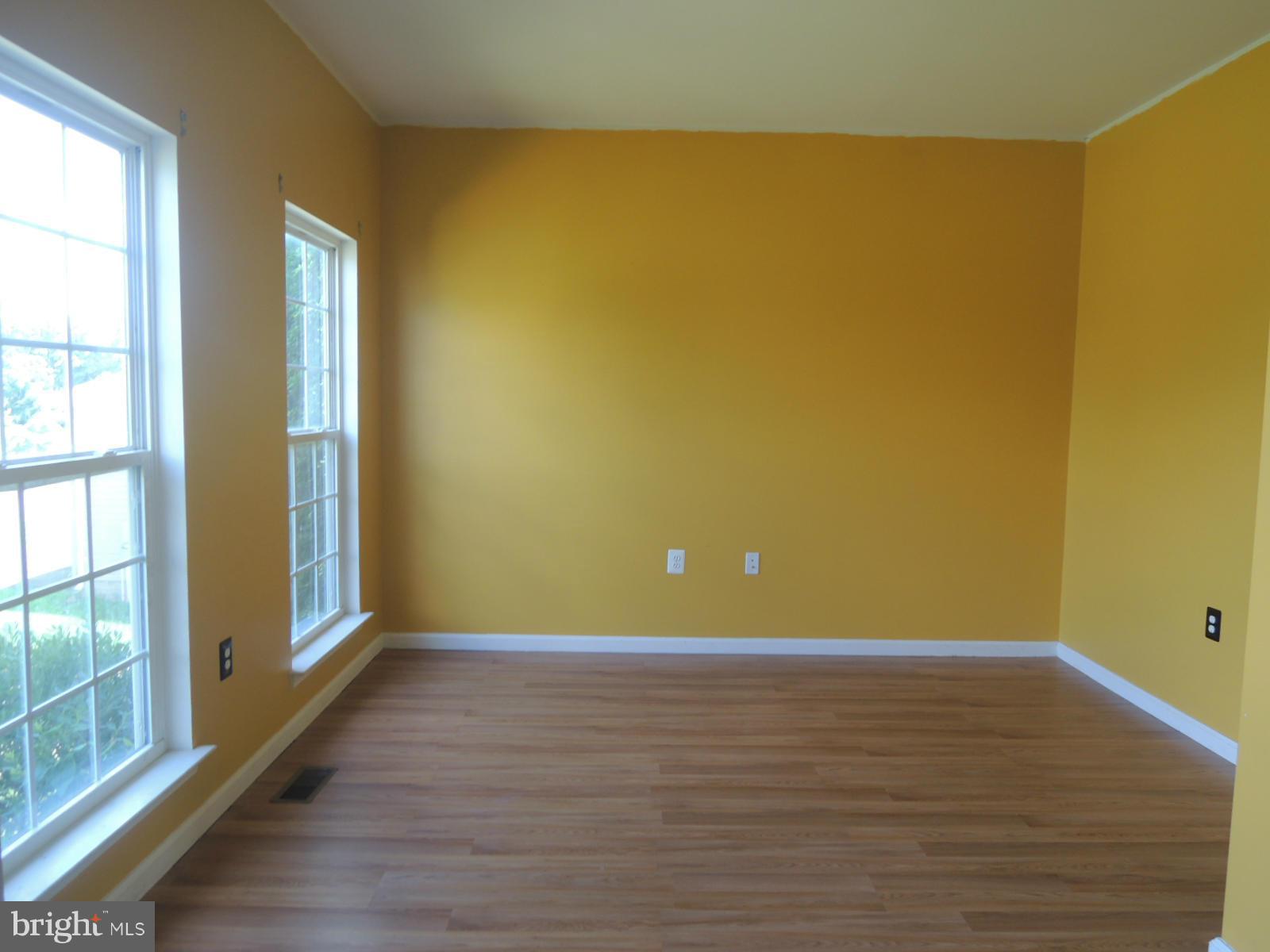 45 Boise Road Inwood, WV 25428 - Photo 8 of 30 a view of an empty room with wooden floor and a window