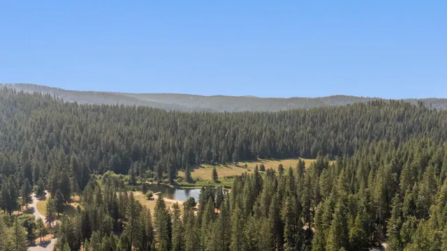 a view of a town with mountains in the background