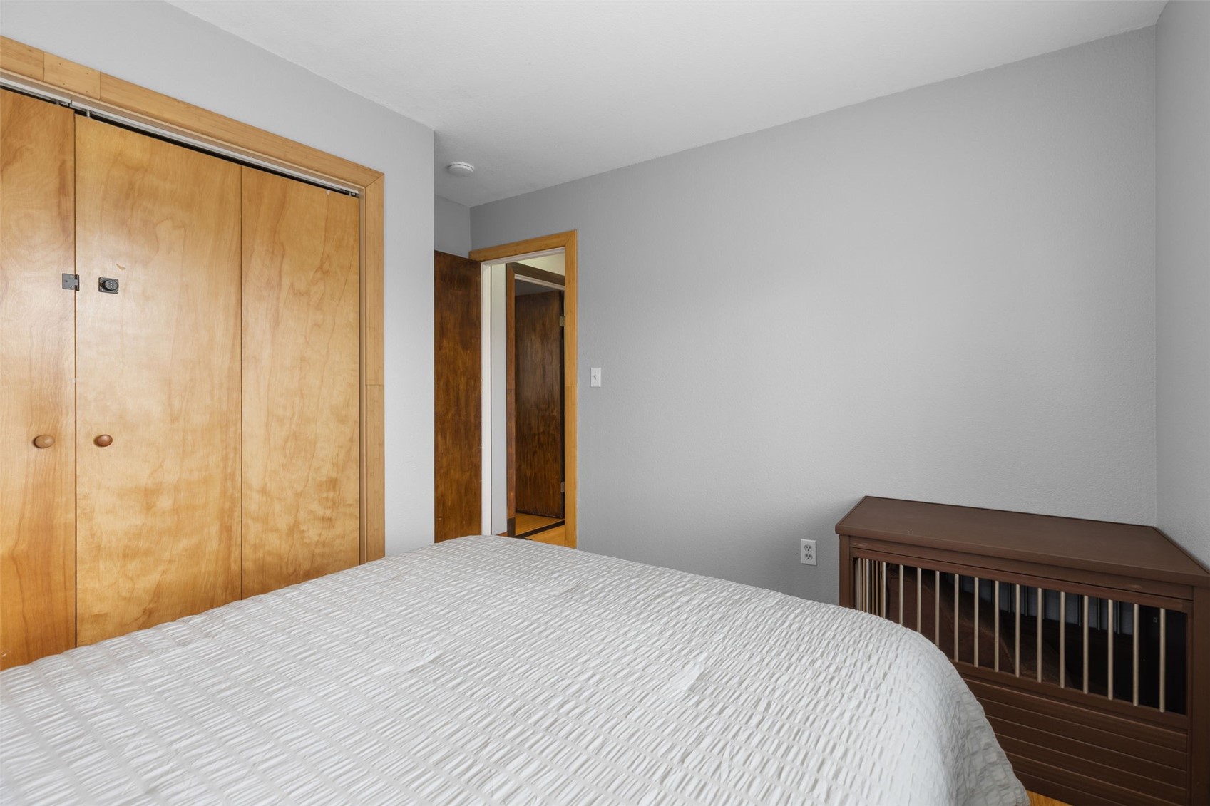 2349 Michigan Hill Road Jefferson, CO 80456 - Photo 18 of 33 a bedroom with a bed and wooden floor
