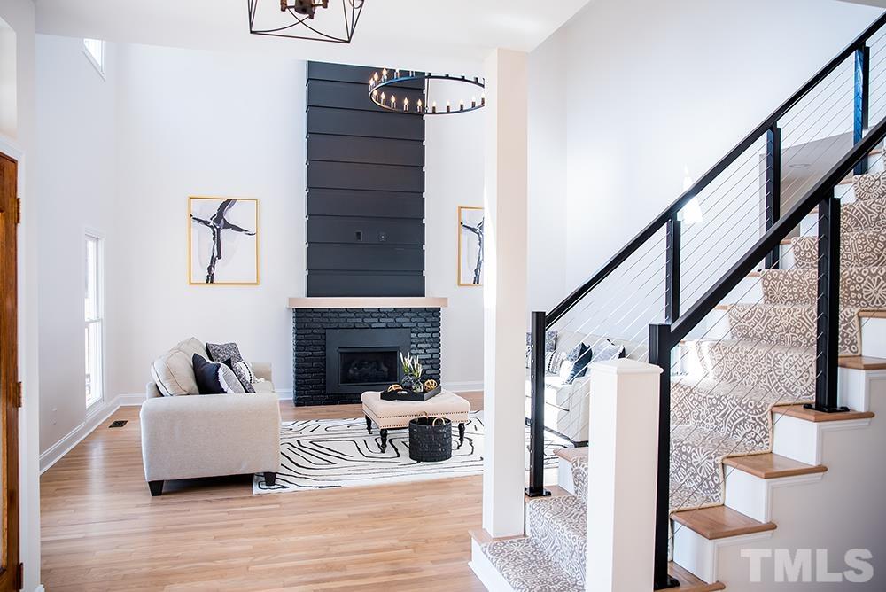 433 Noah Davis Road Roxboro, NC 27574 - Photo 16 of 95 a living room with furniture and a fireplace