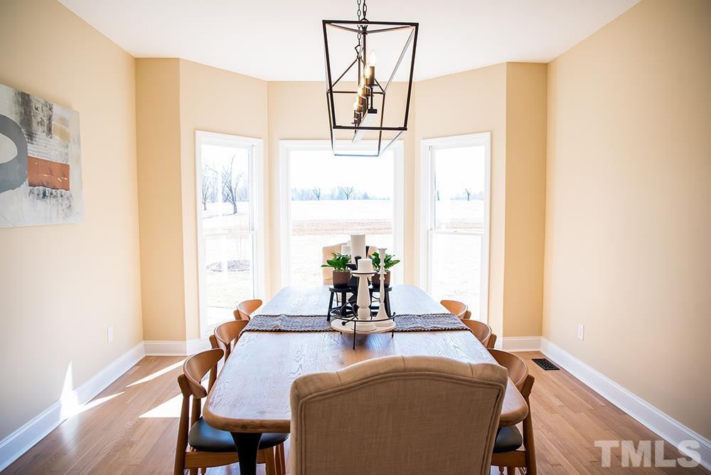 433 Noah Davis Road Roxboro, NC 27574 - Photo 18 of 95 a dining room with table and chairs