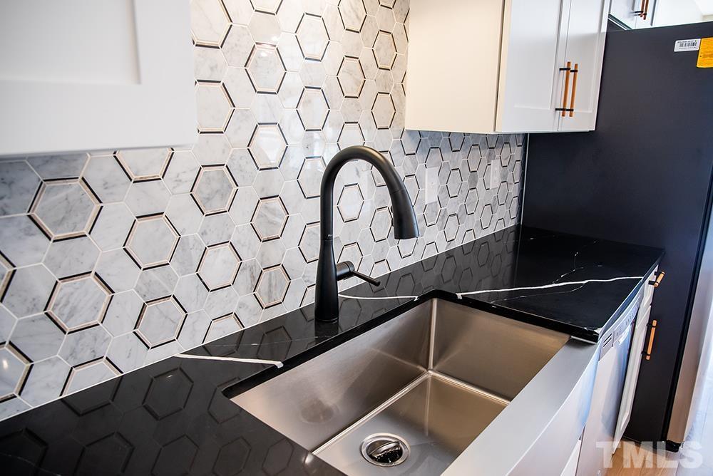 433 Noah Davis Road Roxboro, NC 27574 - Photo 23 of 95 a close view of sink and tap