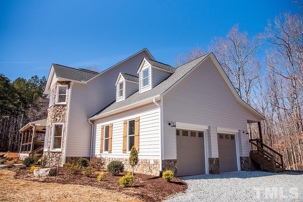 433 Noah Davis Road Roxboro, NC 27574 - Photo 3 of 95 a front view of a house with a yard