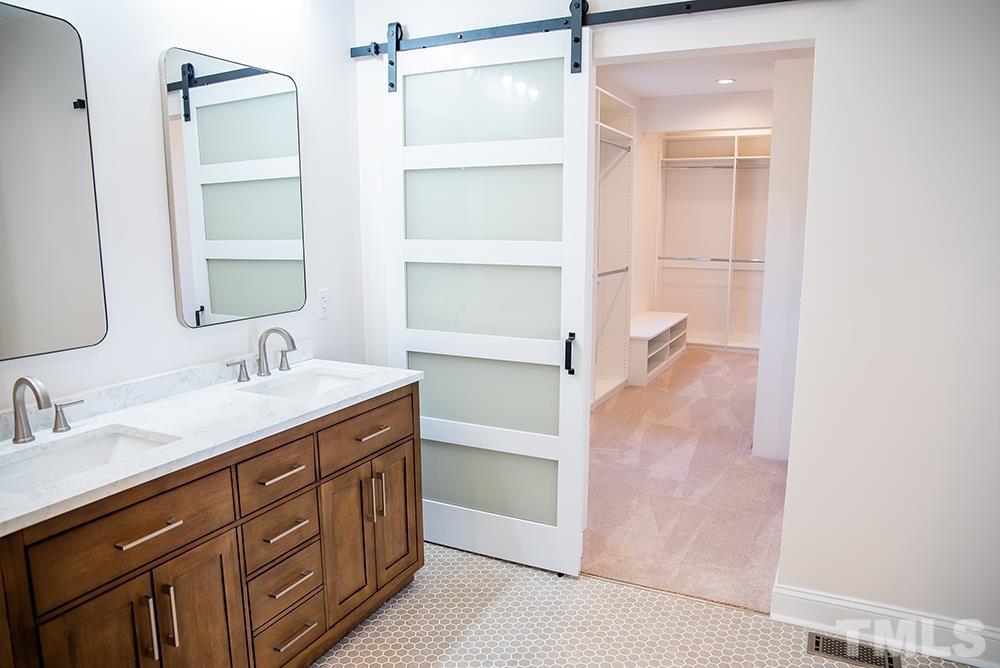 433 Noah Davis Road Roxboro, NC 27574 - Photo 39 of 95 a bathroom with a granite countertop sink mirror and double