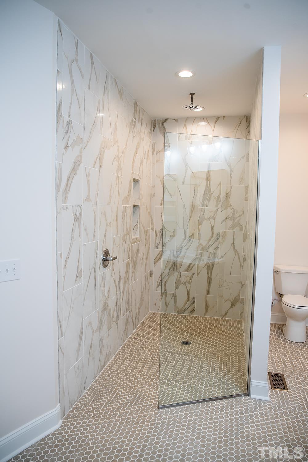 433 Noah Davis Road Roxboro, NC 27574 - Photo 42 of 95 a bathroom with a shower