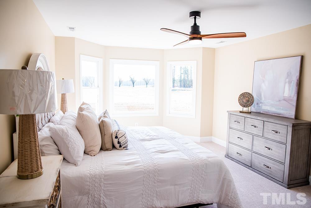 433 Noah Davis Road Roxboro, NC 27574 - Photo 67 of 95 a bedroom with a bed and a window