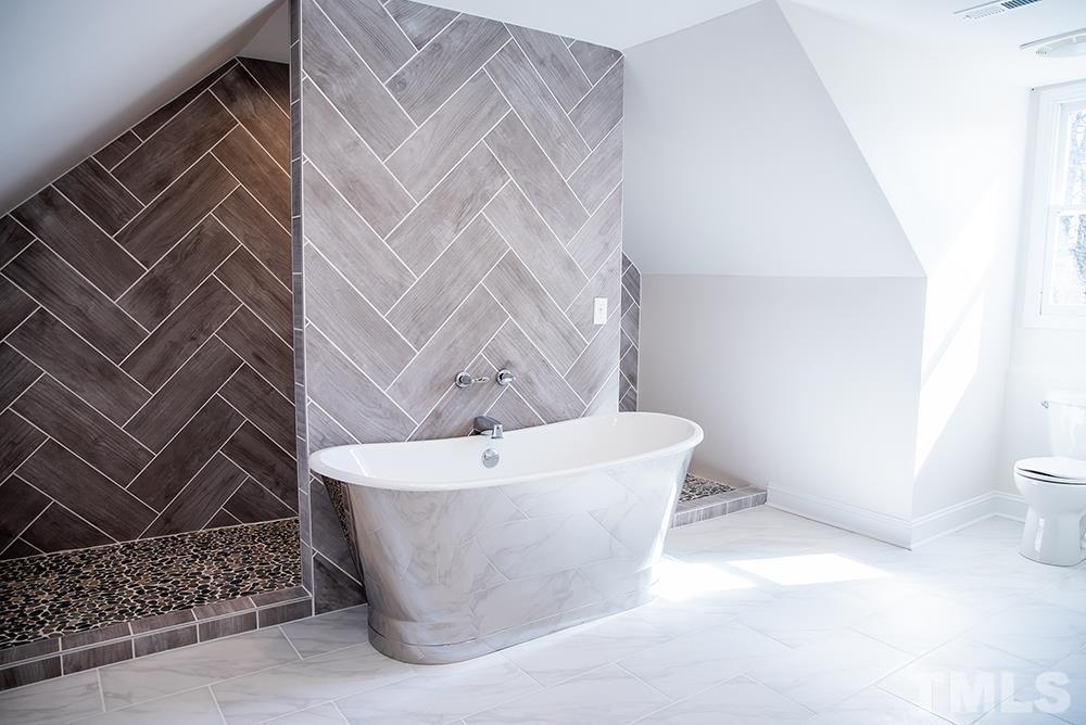 433 Noah Davis Road Roxboro, NC 27574 - Photo 68 of 95 a white tub sitting next to a white wall