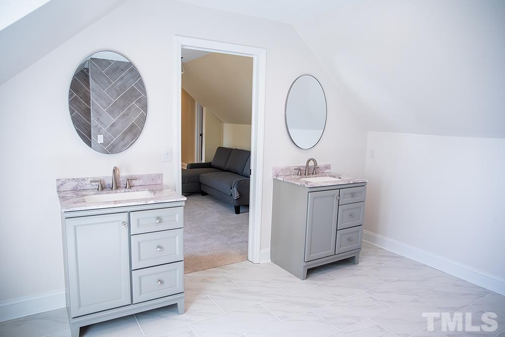 433 Noah Davis Road Roxboro, NC 27574 - Photo 71 of 95 a bathroom with a sink and a mirror