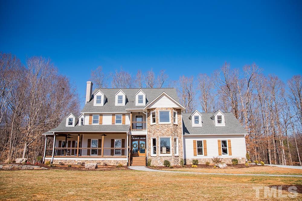 433 Noah Davis Road Roxboro, NC 27574 - Photo 90 of 95 a front view of a house with a lake view