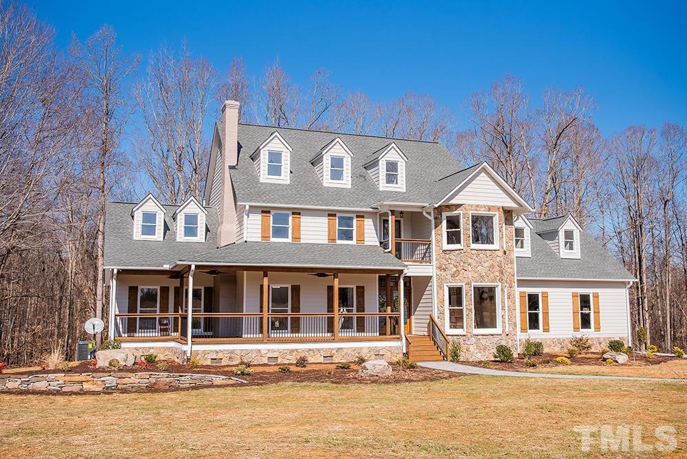 433 Noah Davis Road Roxboro, NC 27574 - Photo 94 of 95 a front view of a building with a garden