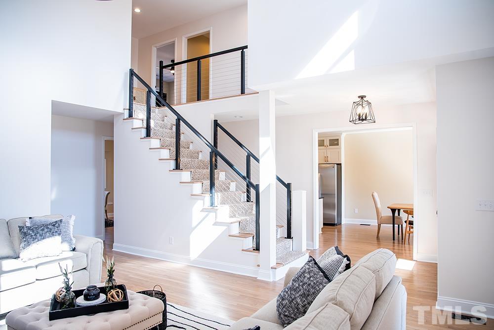 433 Noah Davis Road Roxboro, NC 27574 - Photo 10 of 95 a living room with furniture and wooden floor
