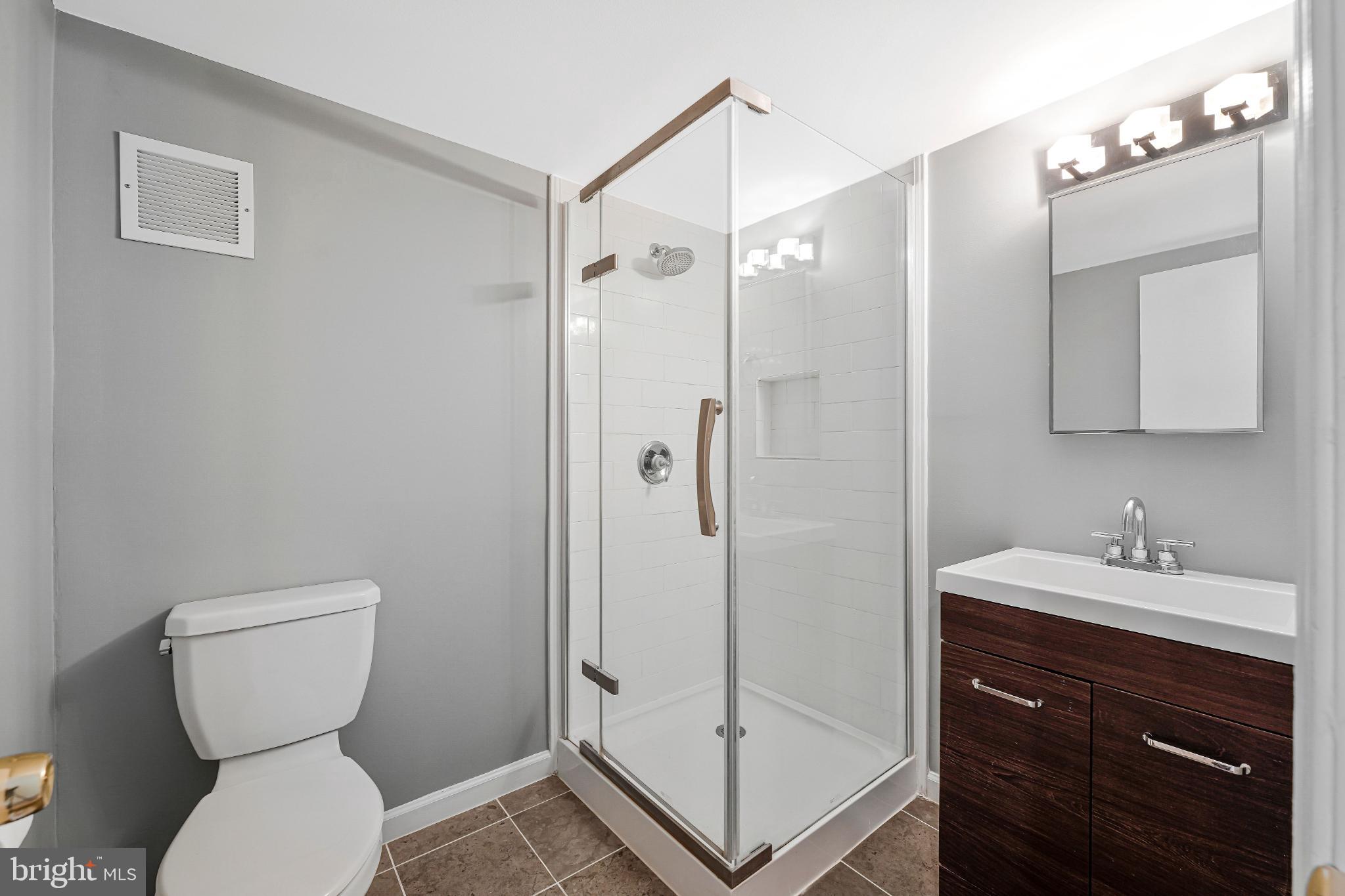 8330 Darlington Court, Unit 467 Springfield, VA 22152 - Photo 11 of 23 Modern bathroom with sleek glass shower.