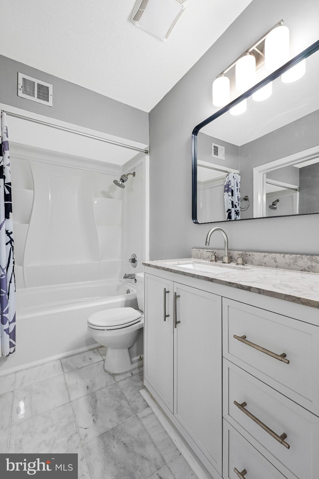 8330 Darlington Court, Unit 467 Springfield, VA 22152 - Photo 17 of 23 Sleek modern bathroom with elegant finishes.