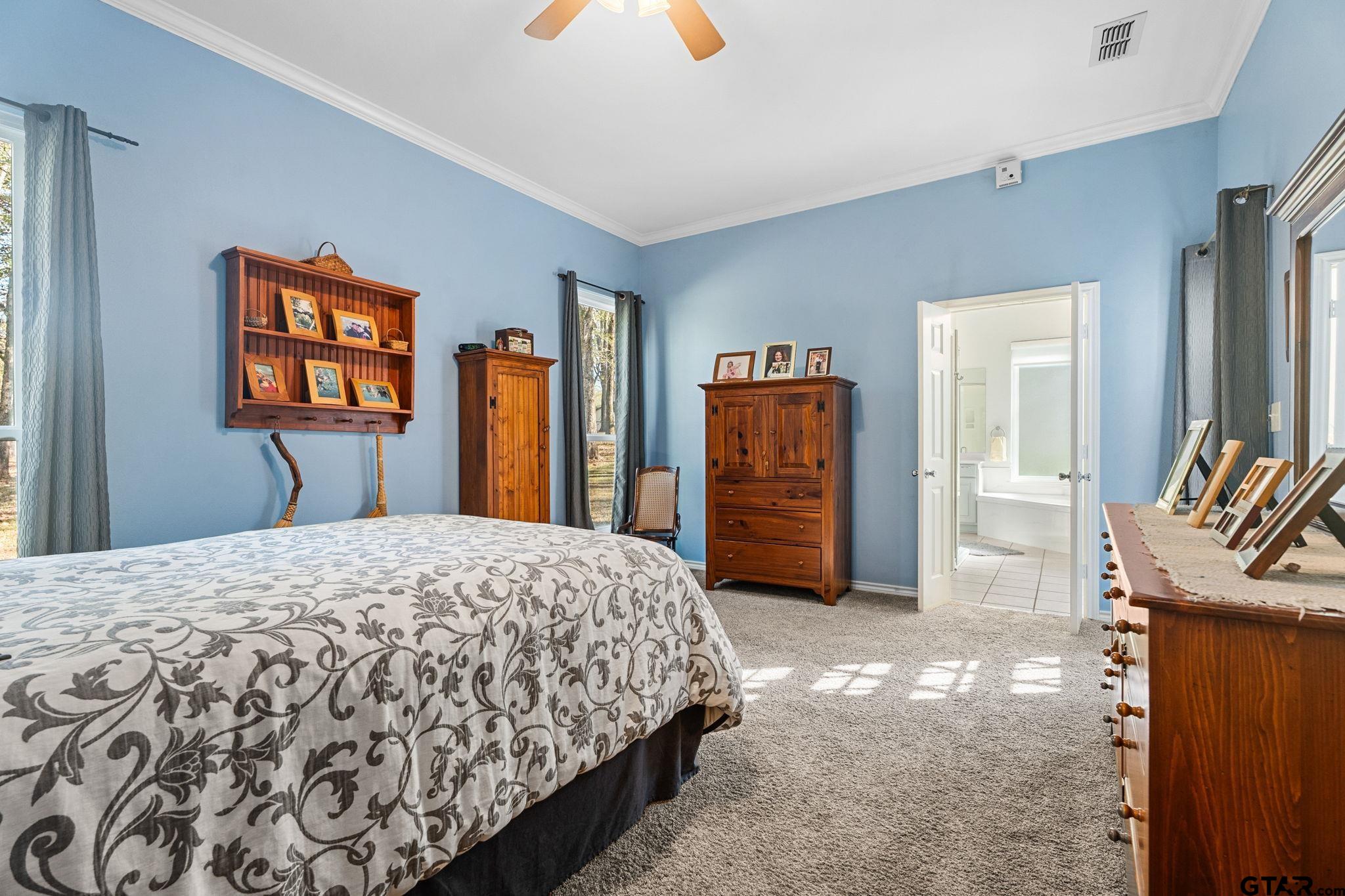 14417 East Ridge Road Arp, TX 75750 - Photo 18 of 47 a bedroom with a bed and a dresser